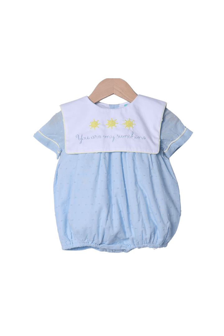 The Smocked Flamingo Apparel & Accessories French Knot You Are My Sunshine Blue Swiss Dot Bib Bubble