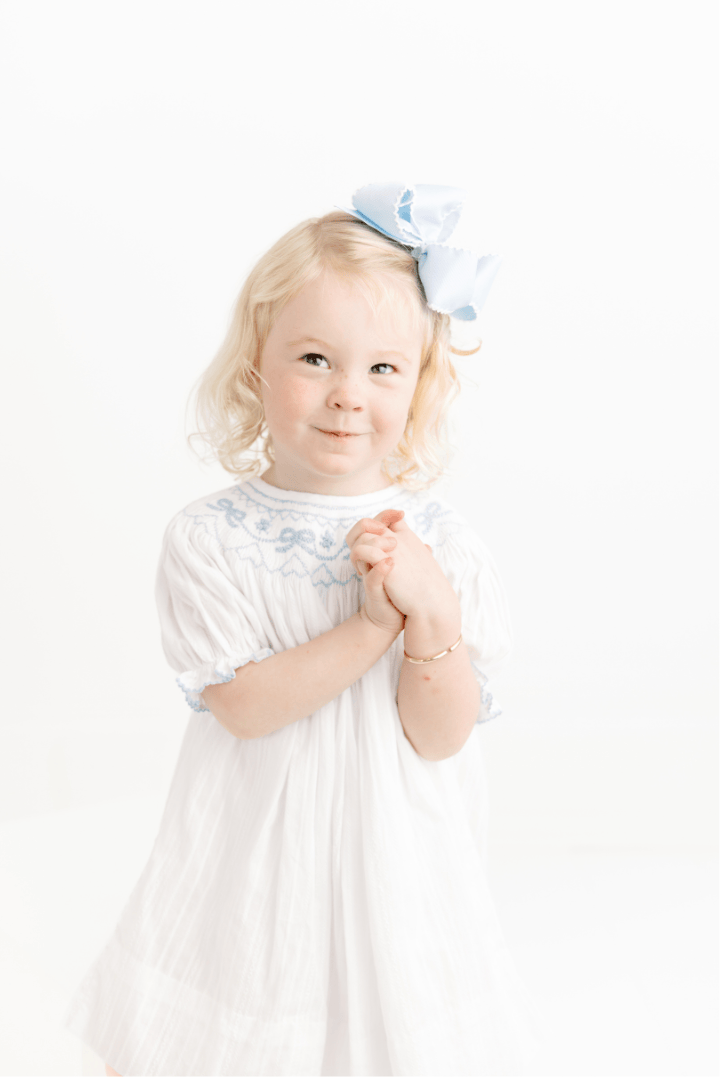 The Smocked Flamingo Apparel & Accessories Smocked Heirloom Blue Bow White Linen Dress