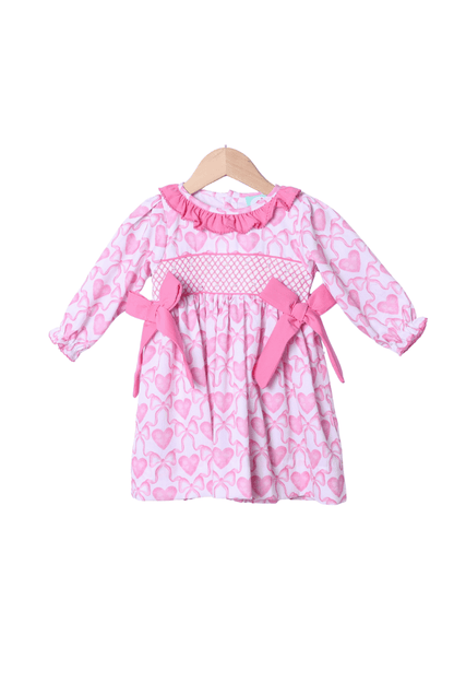 The Smocked Flamingo Apparel & Accessories Smocked Heirloom Pearl Heart and Bow Dress