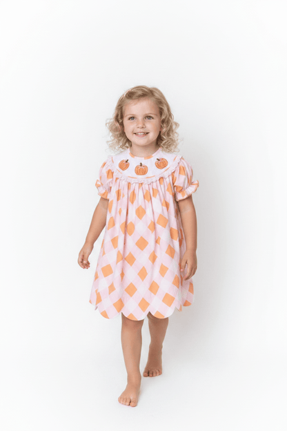 The Smocked Flamingo Children's Clothing Smocked Pumpkin Pink and Orange Buffalo Check Dress