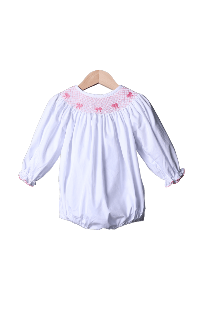 The Smocked Flamingo Smocked Heirloom Pink Bow White Long Sleeve Bubble