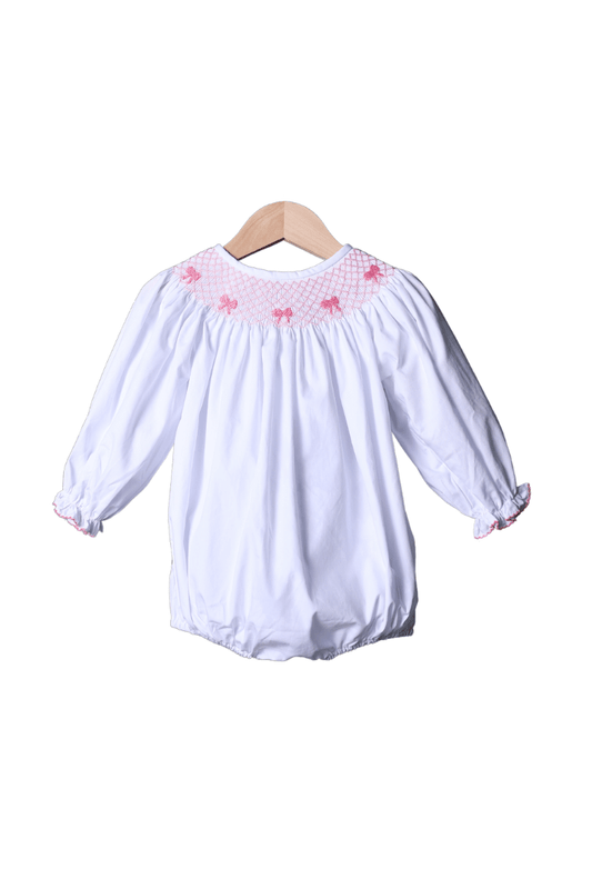 The Smocked Flamingo Smocked Heirloom Pink Bow White Long Sleeve Bubble