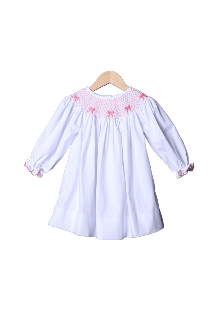 The Smocked Flamingo Smocked Heirloom Pink Bow White Long Sleeve Dress