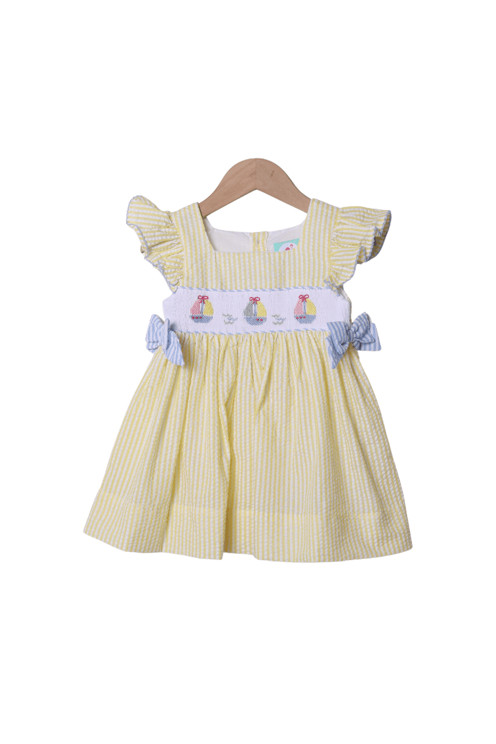 The Smocked Flamingo Smocked Sailboat Blue/Yellow Ruffle Dress
